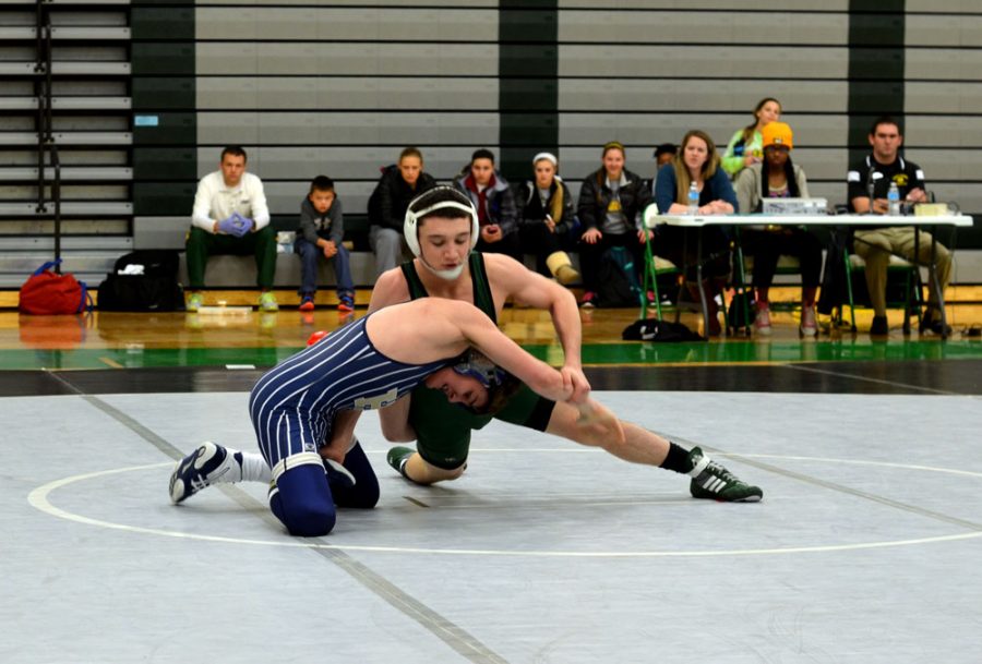 Junior Josiah Kline snuffs out his Helias opponents shot attempt with a well timed sprawl. Photo by Madelyn Stewart. 
