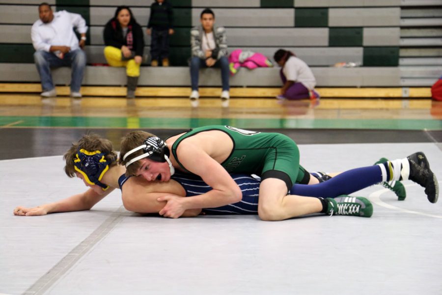 Sophomore+Isaac+lage+works+to+turn+his+Helias+opponent+in+a+dual+on+Jan.+8.+The+Bruins+defeated+the+Crusaders+49-29.+Photo+by+Sury+Rawat.