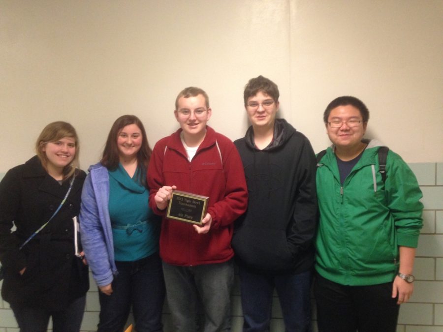 The RBHS quiz bowl team stands with their fourth place plaque at Tiger Bowl VII. Photo by Luke Chval