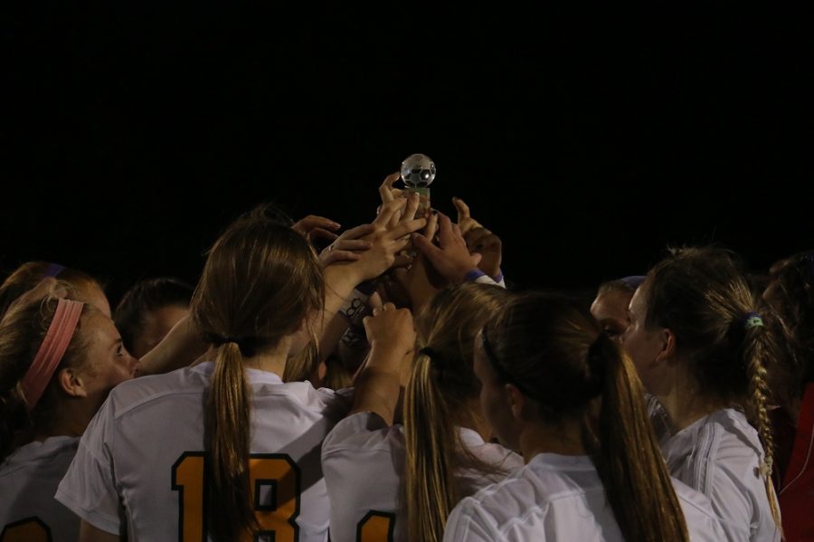 After Anna Aliotos family presented the Memorial Classic trophy to the Bruins, both teams formed one large huddle in tribute to Alioto.
