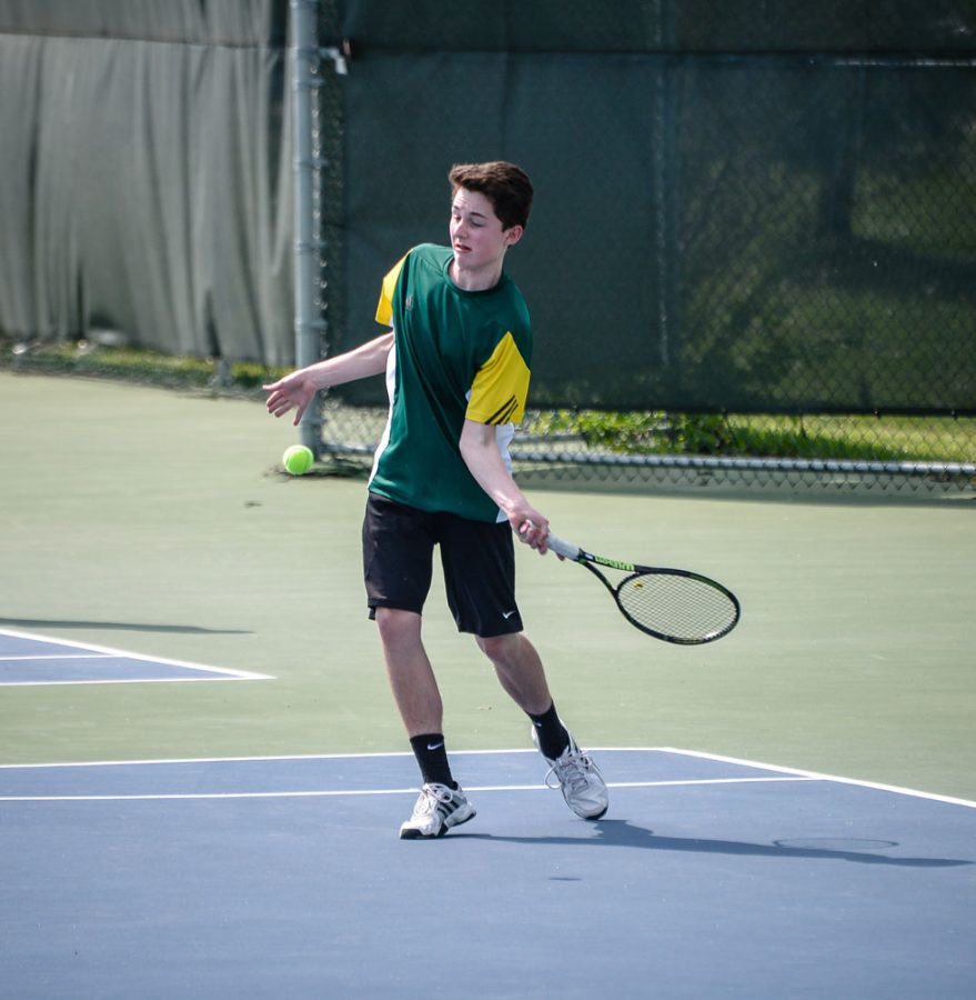 Freshman Lincoln Wasden hits a forehand during his doubles match against JCHS.
photo by Harsh Singh