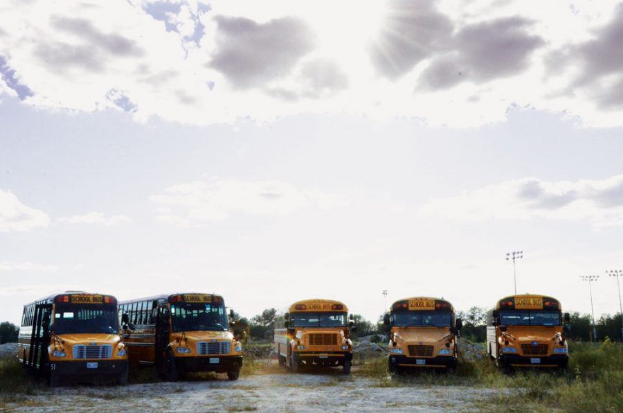 Buses are prepared to pick up students after school. The recent change of bus companies has sparked frustration for students and parents.
Photo by Cassi Viox