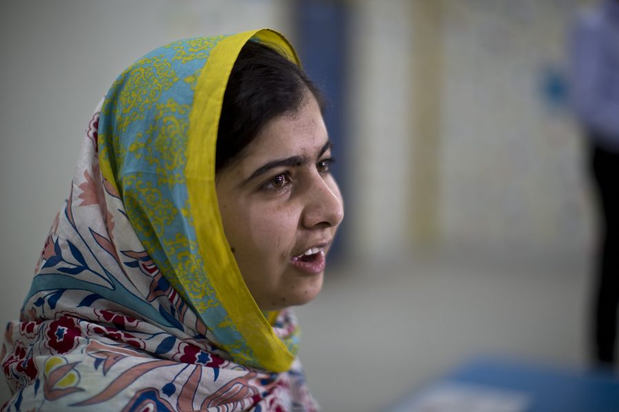 Nobel Peace Prize laureate Malala Yousafzai, 18, speaks during her visit to Azraq refugee camp in Jordan, Monday, July 13, 2015. Rich countries should spend less on weapons in the Syria conflict and more on education, Nobel Peace Prize winner Malala Yousafzai said Monday, calling world leaders quite stingy as she visited the camp for Syrian war refugees. (AP Photo/Muhammed Muheisen)