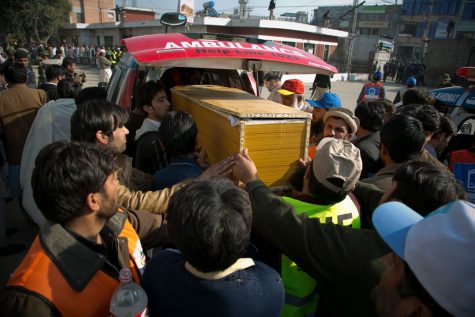 People carry a coffin of a victim killed in an attack, at a local hospital in Charsadda town, some 35 kilometers (21 miles) outside the city of Peshawar, Pakistan, Wednesday, Jan. 20, 2016. Gunmen stormed Bacha Khan University named after the founder of an anti-Taliban political party in the countrys northwest Wednesday, killing many people, officials said. (AP Photo/B.K. Bangash)