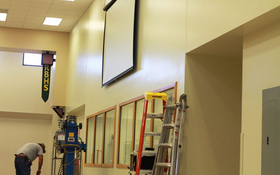 Student Council-purchased projector and screen begin installation