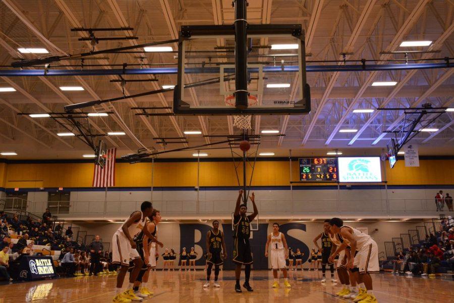 Senior forward Tre Williams (54) shoots a free throw in the third period of the game against Battle. The shot cut the Bruins definite to four points. The Bruins went on to defeat the Spartans 50 to 34. 