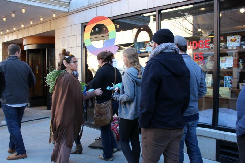 Attendees of the film "The Prison in Twelve Landscapes" hand their tickets to a Q queen outside of the Forrest Theater venue.