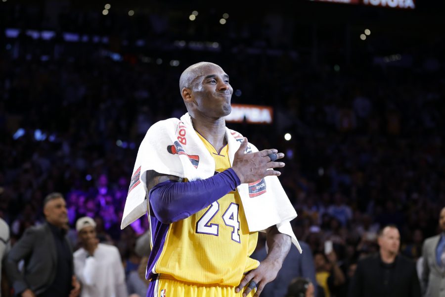 Los Angeles Lakers Kobe Bryant pounds his chest after the last NBA basketball game of his career against the Utah Jazz, Wednesday, April 13, 2016, in Los Angeles. (AP Photo/Jae C. Hong)