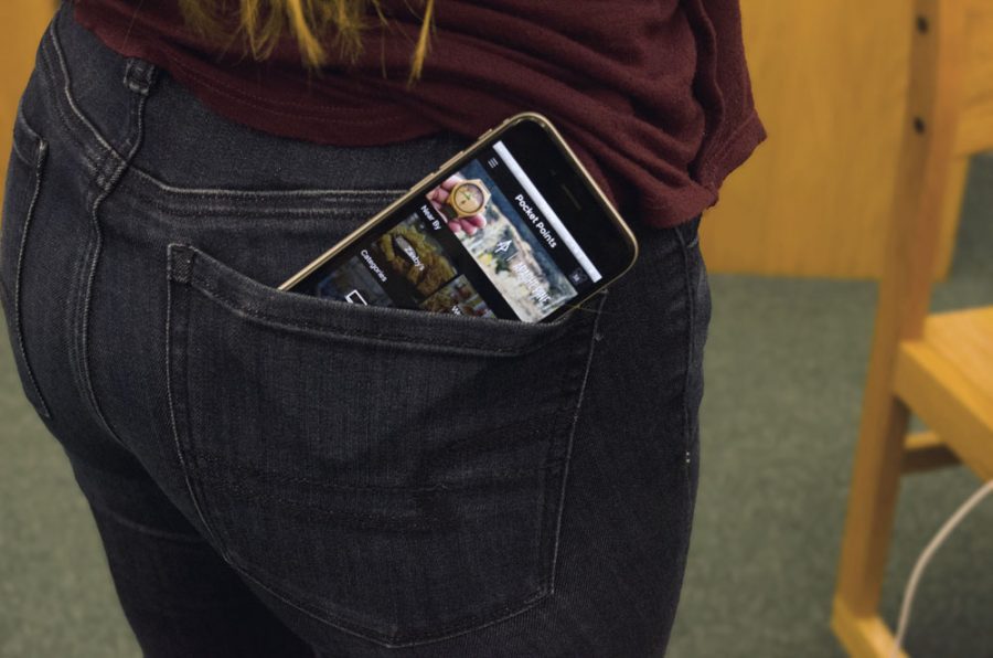 Pocket Points, an app that can help earn incentives at local businesses for keeping phones locked during class, seems to be the newest hit. photo by Cassidy Viox