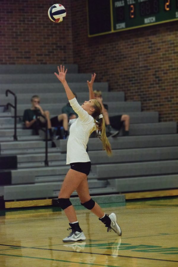 Sophomore Abby Green prepares to serve the ball against the Jefferson City Jays. The Bruins went on to win the game 2-0. RBHS looks to hold their own in tonight’s match against the Helias Catholic Crusaders. Photo Credit to Abby Blitz