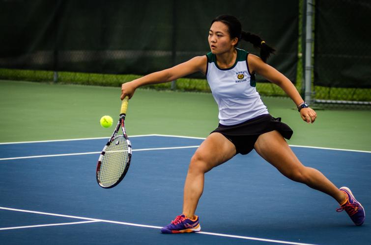 Senior Lisa Zhuang returns the serve in a match at the Columbia Tournament Sept. 17 at Bethel Park. After being crowned the victors of the district tournament Sept. 28, the Lady Bruins hope to continue their success in the sectional tournament beginning Oct. 4. Photo by Yousuf El-Jayyousi