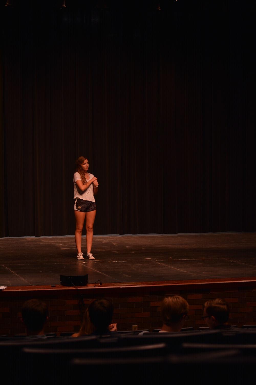 Senior Sarah Merrifield sings her vocal solo audition in front of fellow auditionees and judges.