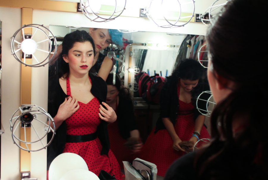 Junior Gabriella Soderman prepares for the Melancholy dress rehersal by taking a quick look in the mirror on Nov. 30.