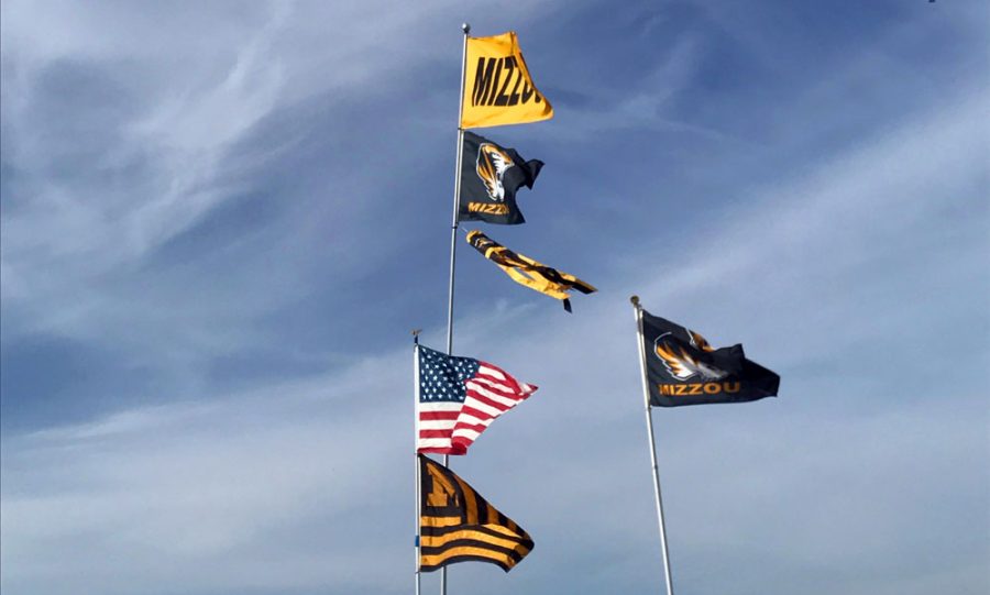 Flags wave at a Missouri Tigers tailgate. Photo by Cassidy Viox