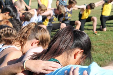 Cross country athletes gather before a meet. Photo by Eléa-Marie Gilles.