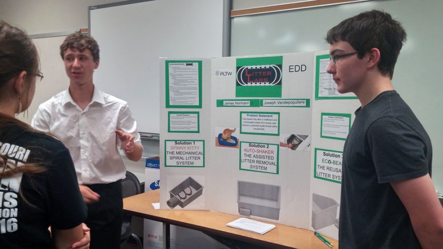 RBHS senior Jim Hormann and HHS Joseph Vandepopuliere present their project, Litter Labs.