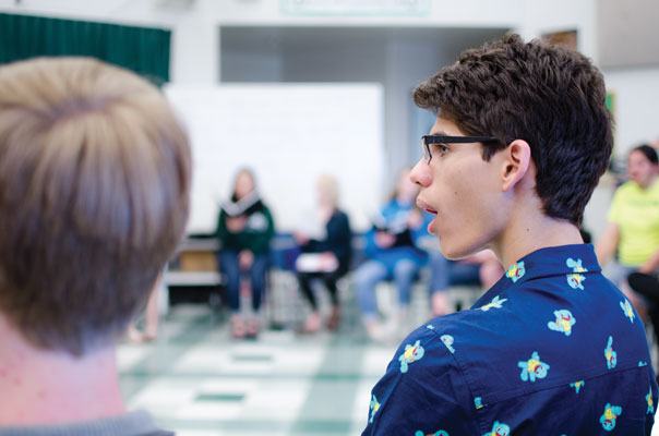 gaining a voice: Senior Nick Alicea loosens up his vocal chords during his
choir class April 23. Alicea and the other choir students use this time to prepare
for the concert that will occur on May 11 at 7 p.m. in the PAC.
