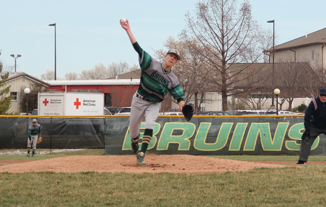 one, two, three strikes: Junior Devin Bernskoetter pitches during the team’s season opener against Grain Valley March 18. The Bruins ended up losing the game 4-7.  