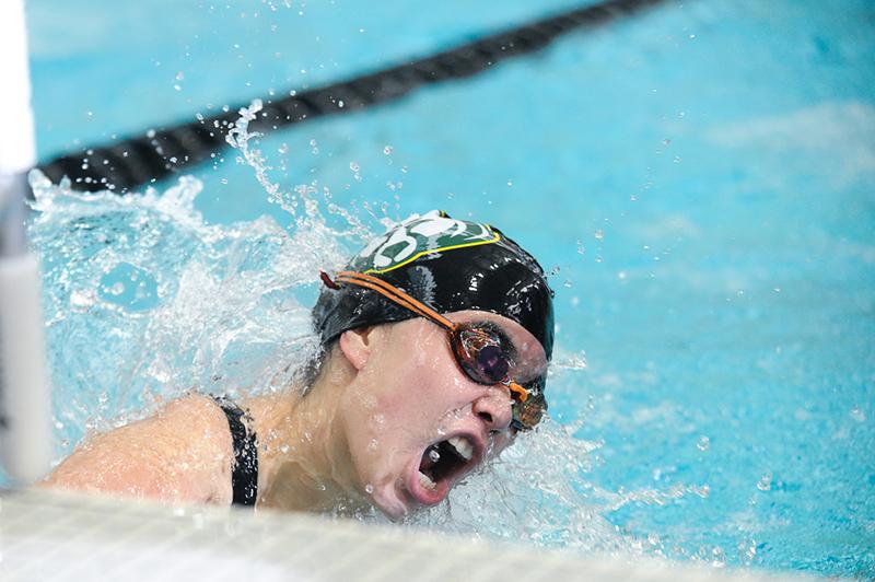 Junior swimmer Piper Osman takes a turn at the wall during the 100 meter fly event. Osman swam a 1:01.15, taking 10th place overall. Photo by Maya Bell 