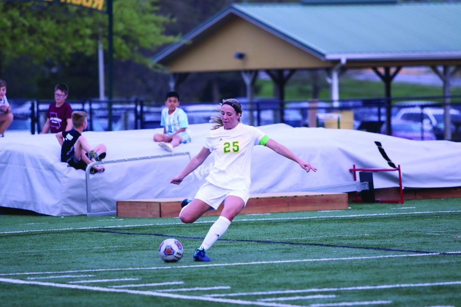 This is a photo of senior co-captain and defensive player Allison Floyd, going for the ball during the girls soccer game Wednesday, May 2. After ending a double overtime tied at zero, RBHS and HHS went into penalty kicks. The Lady Bruins fell to the Kewpies with a final score of (1-0 )and (4-3) in penalty kicks. The team will compete in districts on May 14.