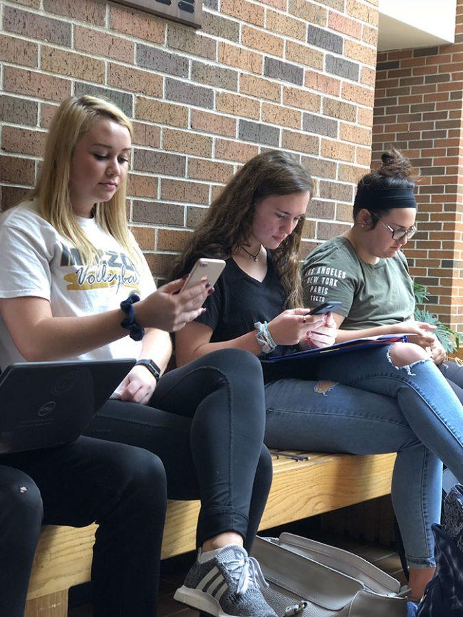 RBHS+students+use+their+phones+during+a+lunch+period.