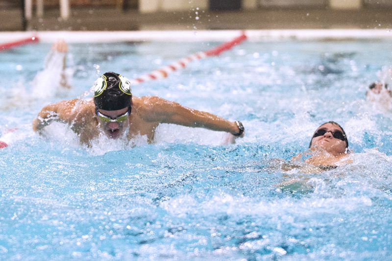Freshman swimmer Nick Clervi propels through the water during practice Sept. 18. Photo by Maya Bell. 