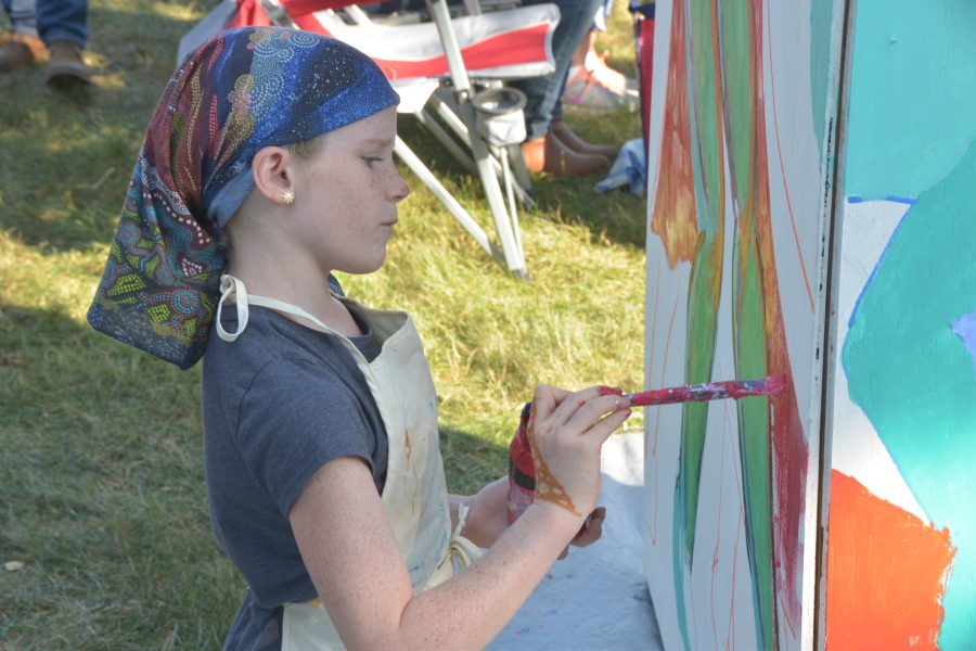 Young artist at the Wildys World art exhibit. Photo by Bailey Stover.