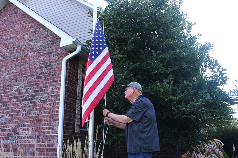 Robert+Wagner+raises+his+flag+before+going+about+his+daily+chores.+Photo+by+Camryn+DeVore.