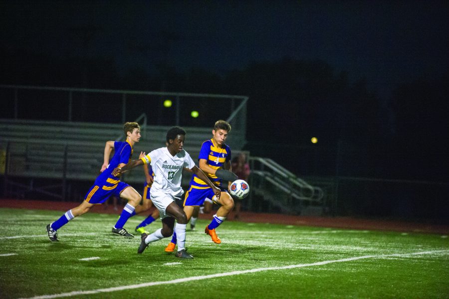 Senior Freddy Nene takes the ball down the field against HHS Sept. 18. The Bruins fell to the Kewpies with a score of 1-0. Photo by Allie Pigg.