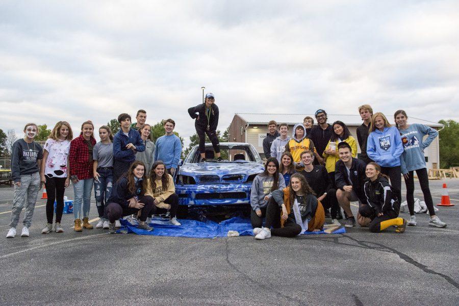 Members of the 2018-2019 student council prepare for the second annual Car Smash fundraiser. This year, the car was donated by English teacher Nicole Clemens. Photo by Maya Bell.