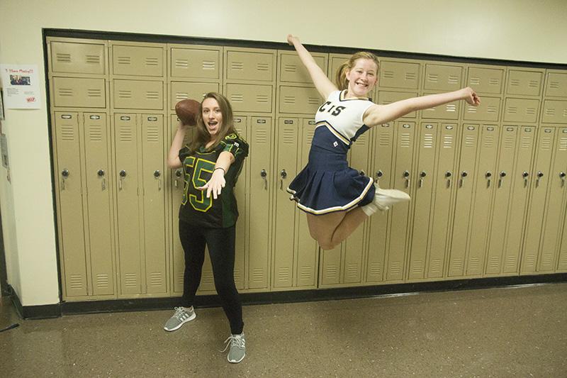 Juniors Audrey Snyder and Megan Phaup make the perfect pair as the football and cheer duo.  Snyder chose to wear an old cheer uniform in memory of when she used to cheer competitively. Photo by Camryn DeVore