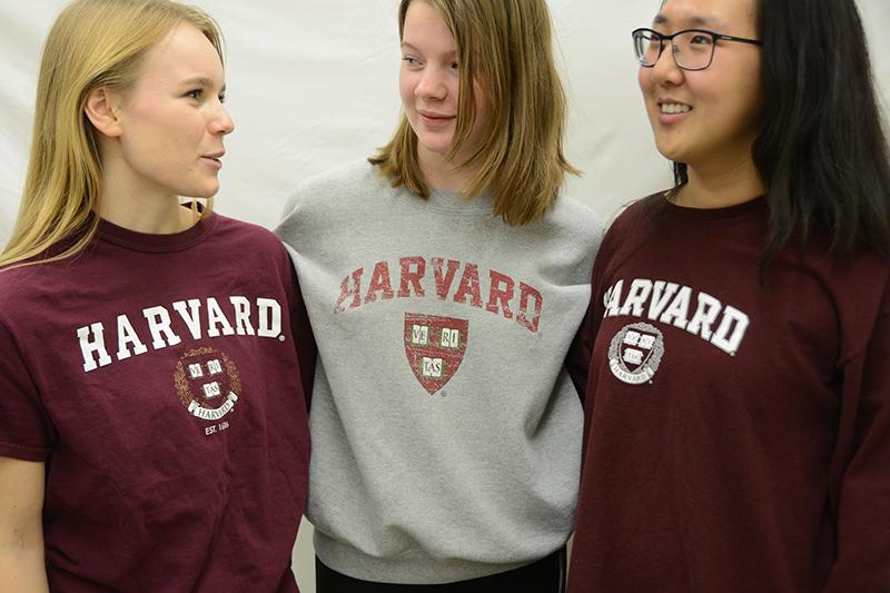 Seniors Megan Pullen, Laura Scoville and Emily Ma discuss the controversy over Harvard admissions. The three have been friends through high school and prepare dread leaving each other for college next year. Photo illustration by Allie Pigg