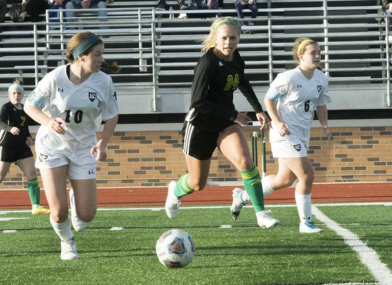 Junior Caroline Cole attempts to direct the ball towards the Helias goal post during the first half of the game.
Photo by George Frey / Bearing News 