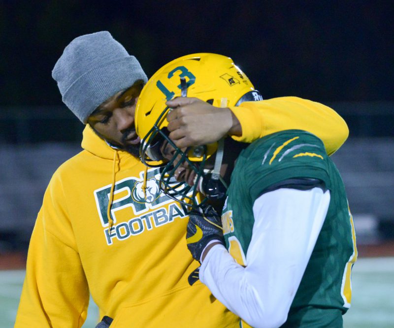 RBHS played in against Blue Springs High School Friday, Nov 9. Coach Cameron Grant comforts varsity player Trey Manual after a painful loss by two points. The score was (25-27.) Photo by Sophie Eaton.
