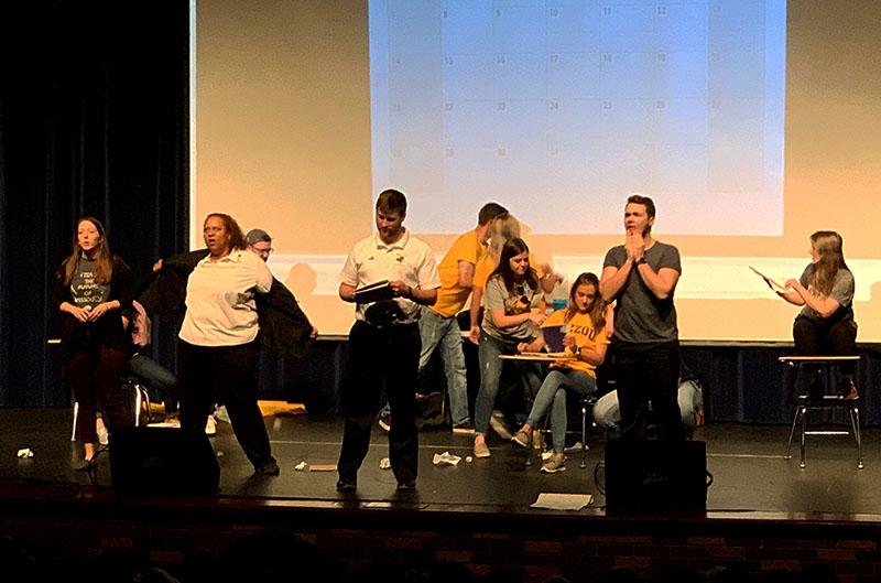 Teachers from Battle perform on April 3 in the RBHS PAC to an audience of students from BHS, HHS, and RBHS.
Photo by George Frey / Bearing News 