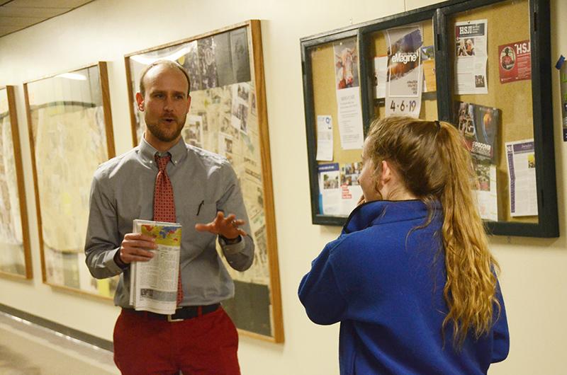 RBHS incoming Principal, Jacob Sirna, speaks with junior Audrey Snyder in the hallway Thursday, March 14. Photo by Allie Pigg.