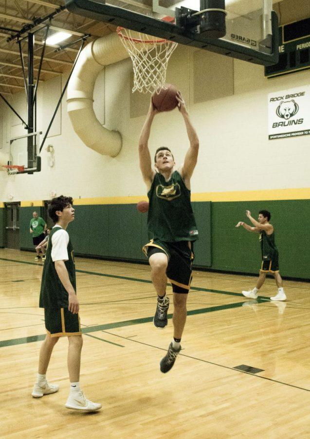 Junior forward Cooper Deneke shoots a layup during practice Dec. 6. At 5:30 p.m. today, the Bruins will take on Miller Career Academy in St. Louis. Photo by George Frey.