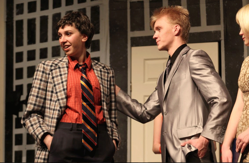 Seniors Polina Kopeikin and Jess interact on stage for the All School Play, One Man, Two Guvnors. The pair played big roles in the performance and brought laughter to the audience. Photo by Corinne Farid