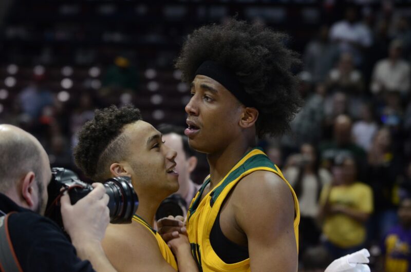 Sophomore Xavier Sykes and senior JaMonta Black take a moment to celebrate winning the Class 5 state championship. The win was the first in Rock Bridge history. Photo by Camryn Devore