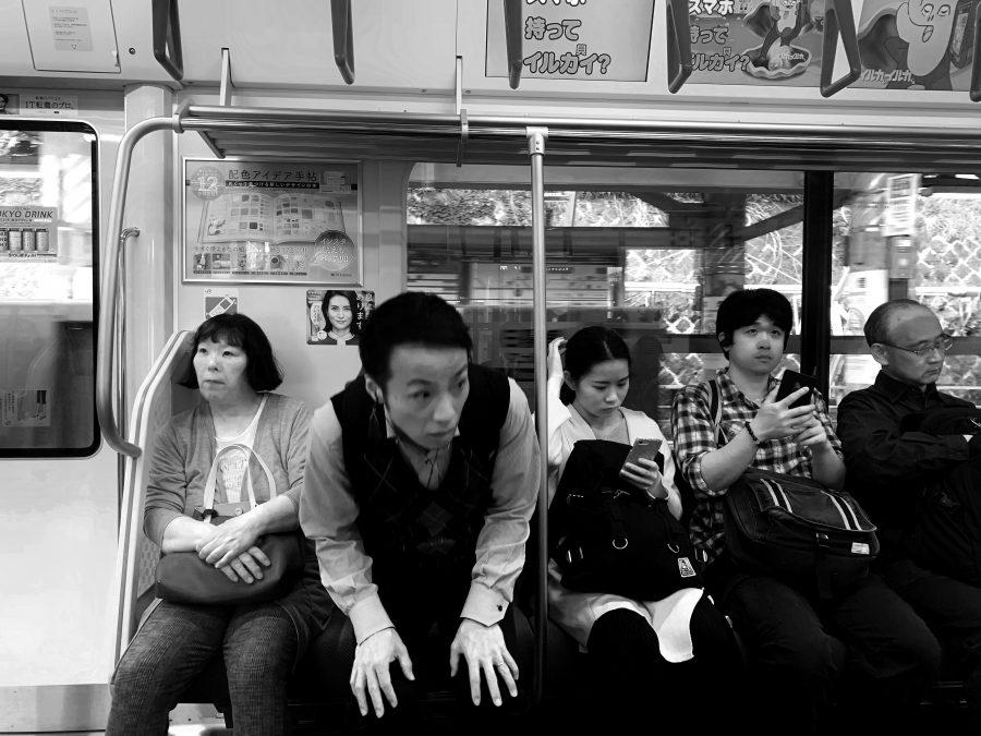 A+man+gazes+at+an+African+woman+aboard+a+Yamanote+Line+Subway+train+Tokyo%2C+Japan+on+April+22%2C+2019.%0APhoto+by+George+Frey+%2F+Bearing+News