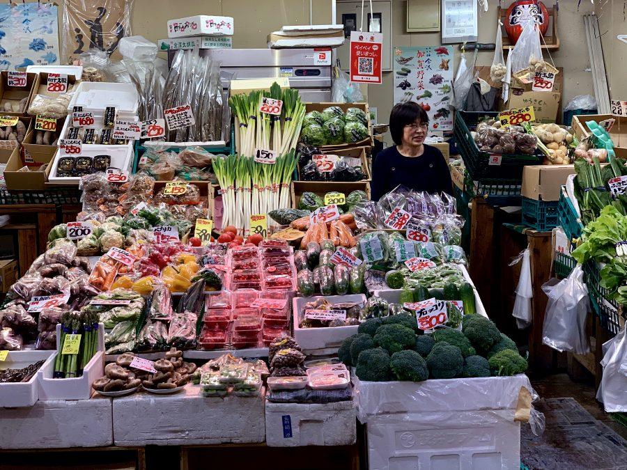 A+woman+sells+farm+fresh+vegetables+and+fruit+at+Umicho+Fish+Market+in+Kanazawa%2C+Japan+on+April+24%2C+2019.%0APhoto+by+George+Frey+%2F+Bearing+News