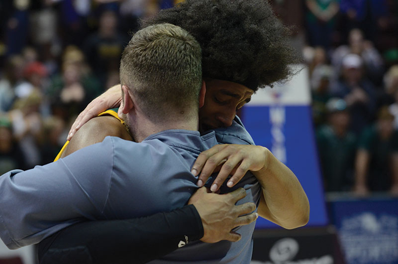 Senior Ja’Monta Black cries after the Bruins win the state championship Saturday, March 16, as he hugs Coach Blaire Scanlon, the head coachs son. This was the first time the Rock Bridge boys basketball team took home the title. Photo by Camryn DeVore