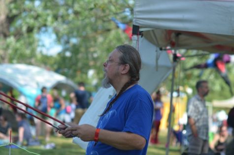 At the Roots N Blues festival Saturday, Sept. 28, BoCoMo Bubble Man Chuck Meal delights audiences with bubbles in a variety of sizes and colors as they catch the afternoon light. Photo by Bailey Stover.