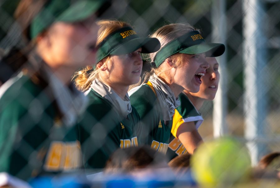 The softball team cheers at their game against Tolton Catholic High School Wednesday, Sept. 23. Photo by Ana Manzano.