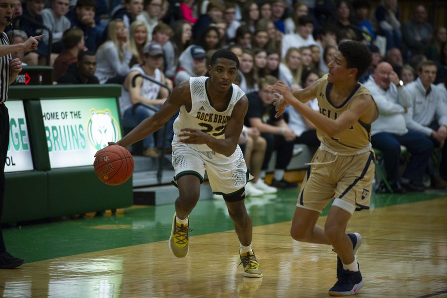 Senior guard Charles Wilson blows past a Helias Defender in the fourth quarter of the game. Wilson has become a key part of the Bruins offense in the past year. 