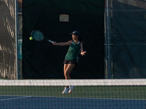Junior Maggie Lin hits a forehand shot at girls tennis districts Thursday, Oct. 8. Photo by Ana Manzano.