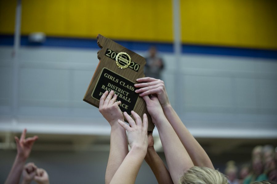 The+Bruins+lift+their+District+championship+trophy+in+the+air+after+being+awarded+it+from+a+MSHAA+representative.%0APhoto+by+Camryn+DeVore.