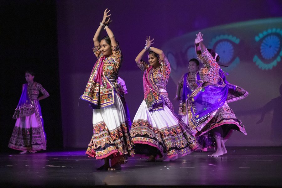 The Garba Queens perform a folk dance for the audience. Riya Amin, sophomore, lead the dance line. Participating for her second year she said, [India Nite] is a great way to get involved in the community. Photo by Sarah Mosteller.