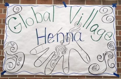 Photo of Global Village Henna poster in the main commons by Bailey Stover.