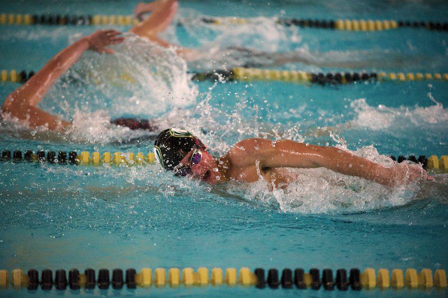 Boys swim and dive overcome obstacles, bond with crosstown foes